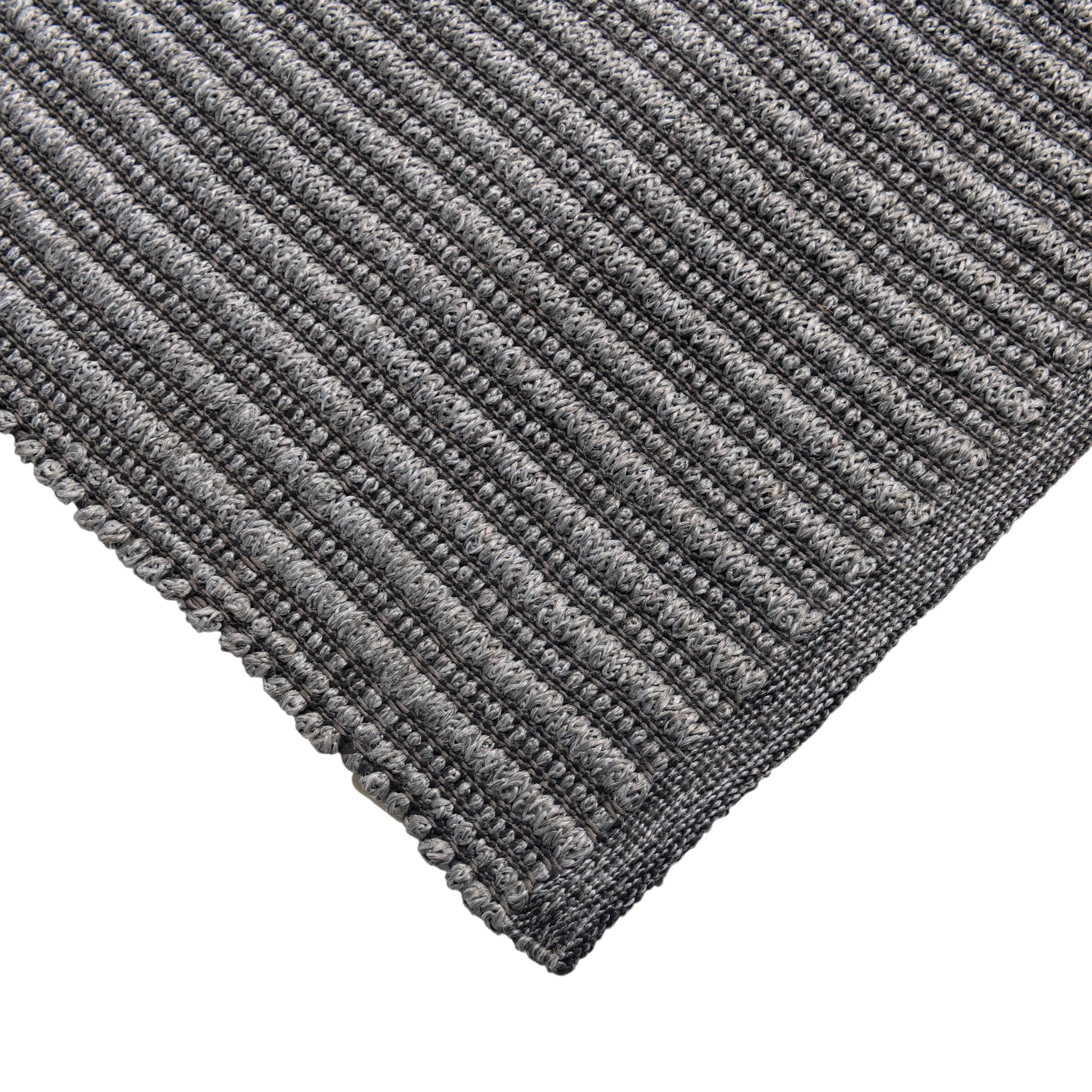 Close-up of a textured gray rug corner on a white background